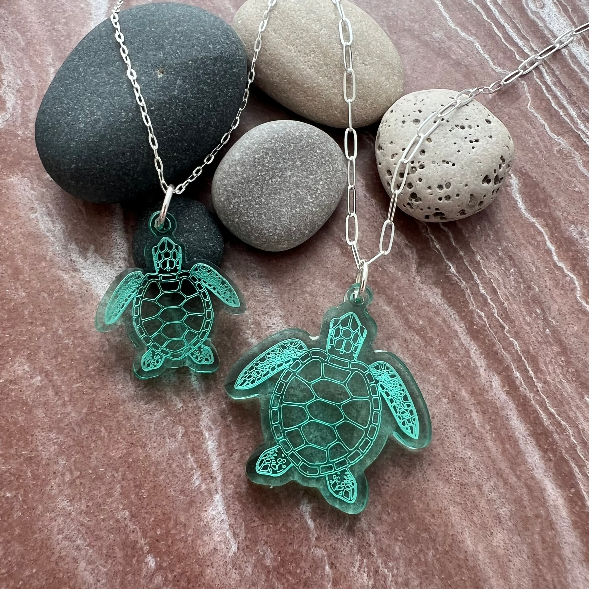 Image of Sea Turtle necklaces on red rock background.