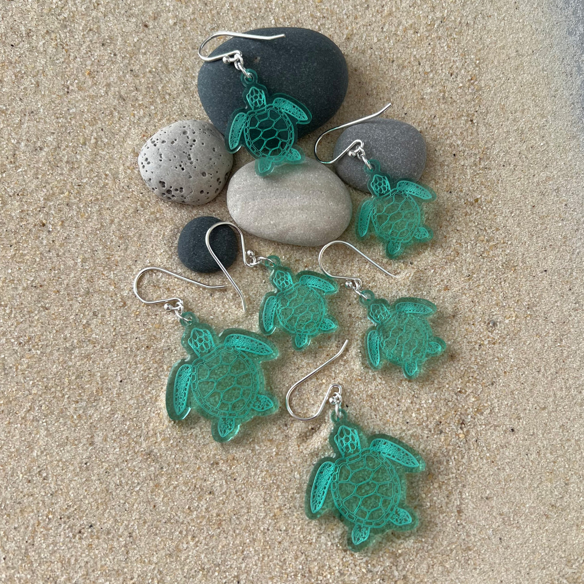Group of sea turtle earnings, large and small, lightweight green acrylic, laser cut with sterling silver ear wires.